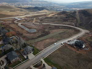 Aerial view of property's location with a mountainous background