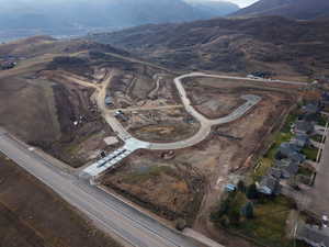 Aerial overview of property's location with a mountainous background
