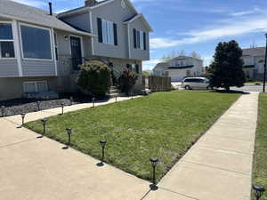 View of home's exterior featuring a residential view and roof with shingles