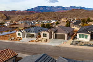 Aerial view of residential area with a mountain backdrop