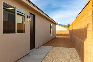 View of side of property featuring a mountain view and stucco siding
