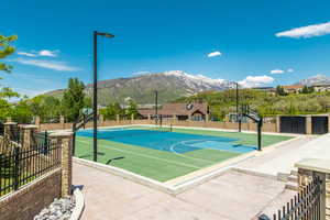 View of sport court featuring community basketball court, a mountain view, and a tennis court