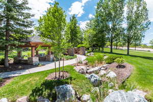 Surrounding community featuring a patio area, a lawn, and a gazebo