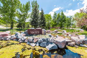 Community sign featuring a garden pond