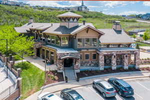 View of building exterior featuring uncovered parking