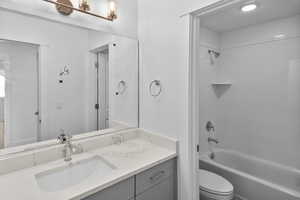 Full bathroom featuring vanity and shower / tub combination