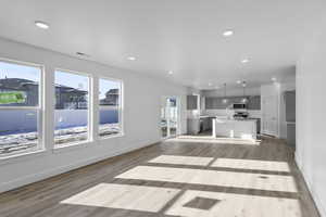 Unfurnished living room with recessed lighting and light wood-style floors