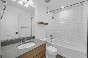 Bathroom featuring  shower combination and vanity