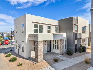Contemporary home with stucco siding and stone siding