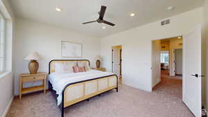 Bedroom featuring light colored carpet, recessed lighting, and ceiling fan