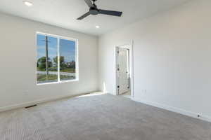 Empty room featuring carpet floors, recessed lighting, and a ceiling fan