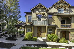 Craftsman inspired home with board and batten siding and stone siding