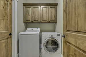Washroom with independent washer and dryer and cabinet space