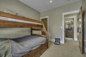 Carpeted bedroom featuring baseboards and recessed lighting