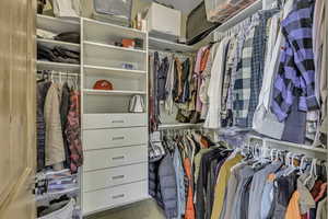 Spacious closet with carpet flooring