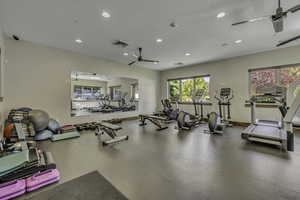 Gym featuring a ceiling fan and recessed lighting
