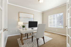 Carpeted office space featuring crown molding and french doors