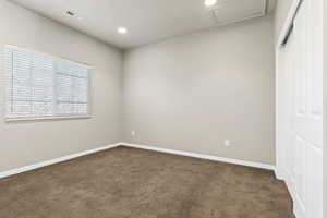 Upstairs bedroom featuring carpet flooring, a closet, and recessed lighting
