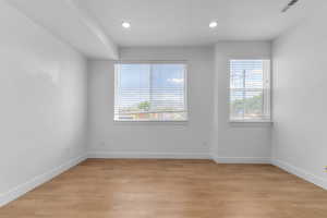 Unfurnished room featuring light wood-style floors and recessed lighting