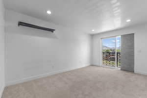 Spare room with light colored carpet and recessed lighting