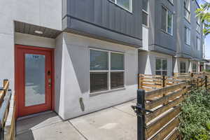View of exterior entry featuring stucco siding