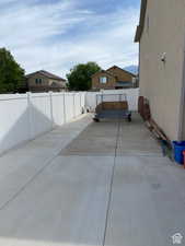 Fenced backyard featuring a mountain view