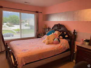 Bedroom featuring carpet flooring