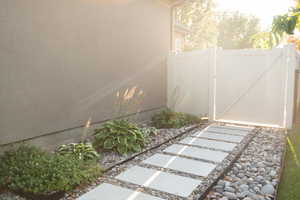 View of yard featuring a gate