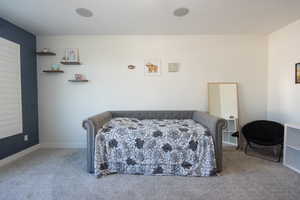 Bedroom with light colored carpet