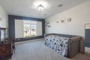 Carpeted bedroom with baseboards