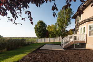 Fenced backyard featuring a patio area and stairs