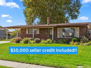 Single story home with brick siding and a chimney