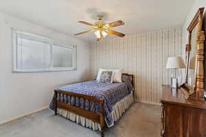 Bedroom with carpet flooring and ceiling fan