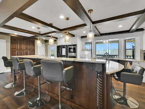 Bar area with white cabinetry, beamed ceiling, dark wood-style flooring, decorative backsplash, and coffered ceiling