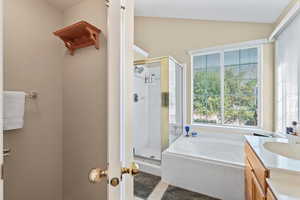 Master bathroom with vaulted ceiling
