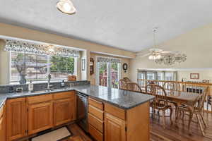 Kitchen with vaulted ceiling and a large peninsula