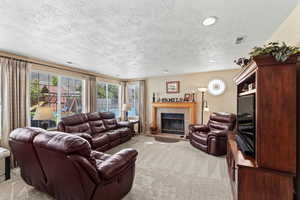 Large family room includes a fireplace and mountain views