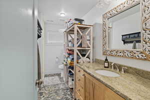 Full bathroom with vanity and a shower with shower curtain