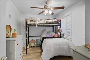 Bedroom featuring light wood-style floors and a ceiling fan