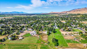 Aerial view of property's location with a mountain backdrop