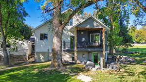 Rear view of house with a wooden deck