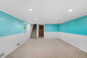 Family room 2 with crown molding, light carpet, recessed lighting, and stairway