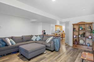 Living area 3 with light wood-style floors