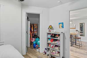Bedroom with light wood-style flooring
