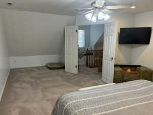 Carpeted bedroom featuring lofted ceiling, recessed lighting, and ceiling fan