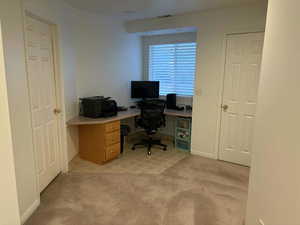 Office area with light carpet and baseboards