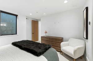 Bedroom with recessed lighting and baseboards