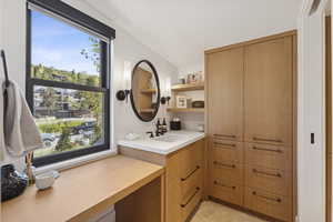 Bathroom featuring vanity and light tile patterned floors