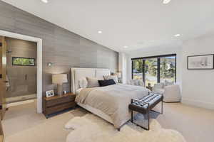 Bedroom with recessed lighting, access to exterior, vaulted ceiling, and light colored carpet