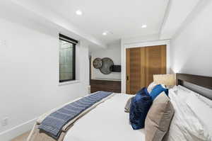 Bedroom featuring a closet, carpet, and recessed lighting
